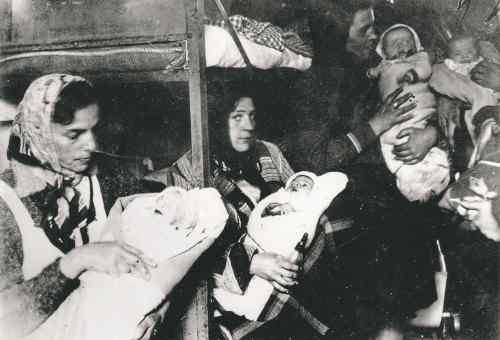 LITTLE, BROWN
Ukrainian and Russian mothers and their children are photographed shortly after the camp's liberation in April 1945.