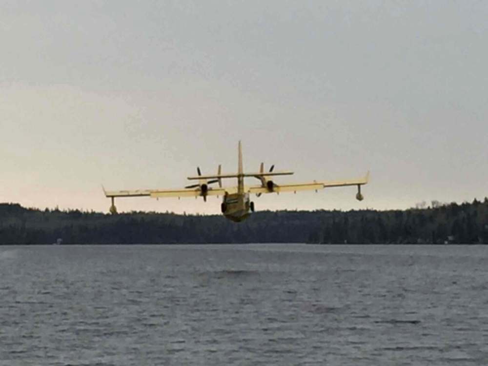 Waterbomber landing at Caddy Lake to fill up on Sunday afternoon - PHOTO CREDIT JAN WATTERS