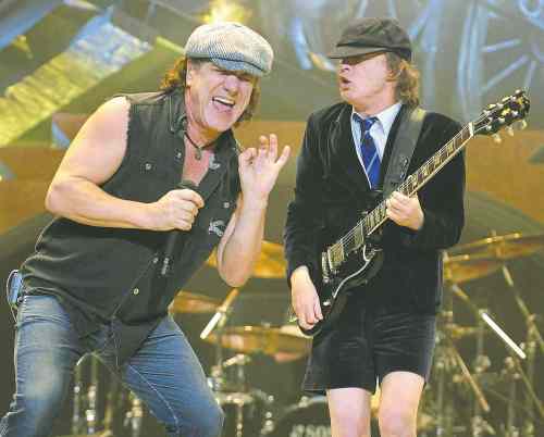 Jeff Siner/Charlotte Observer/MCT
AC/DC lead singer Brian Johnson, left, and guitarist Angus Young.