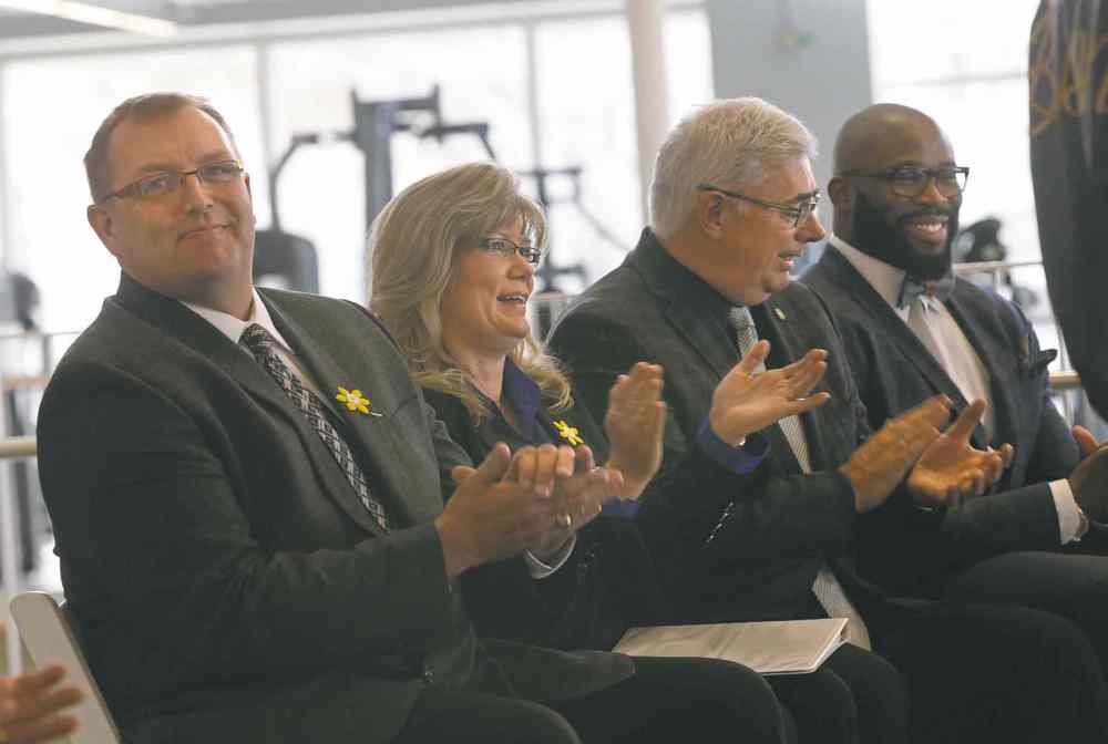 Wayne Glowacki / Winnipeg Free Press
Education Minister Peter Bjornson (below left), MP Shelly Glover, University of Manitoba president David Barnard and ex-Bisons football player Israel Idonije are all smiles at the unveiling of the university's new Active Living Centre Tuesday.