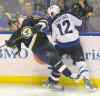 Bill Boyce / The Associated Press
The Blues' Ryan Reeves and the Jets' Drew Stafford collide during the Jets' win in St. Louis Tuesday. Coach Paul Maurice said the reason for a day off was 'all physical.'