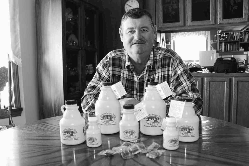 Photos by Bill Redekop / Winnipeg Free Press
Bob Gass displays his Manitoba Maple Syrup brand. He says It�s 100 per cent maple syrup, unlike some brands that add sugar.