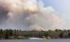 JOE BRYKSA / WINNIPEG FREE PRESS
Water Bombers from Ontario scoop water in Caddy Lake to fight a forest fire near Nora Lake in the Whiteshell Monday.