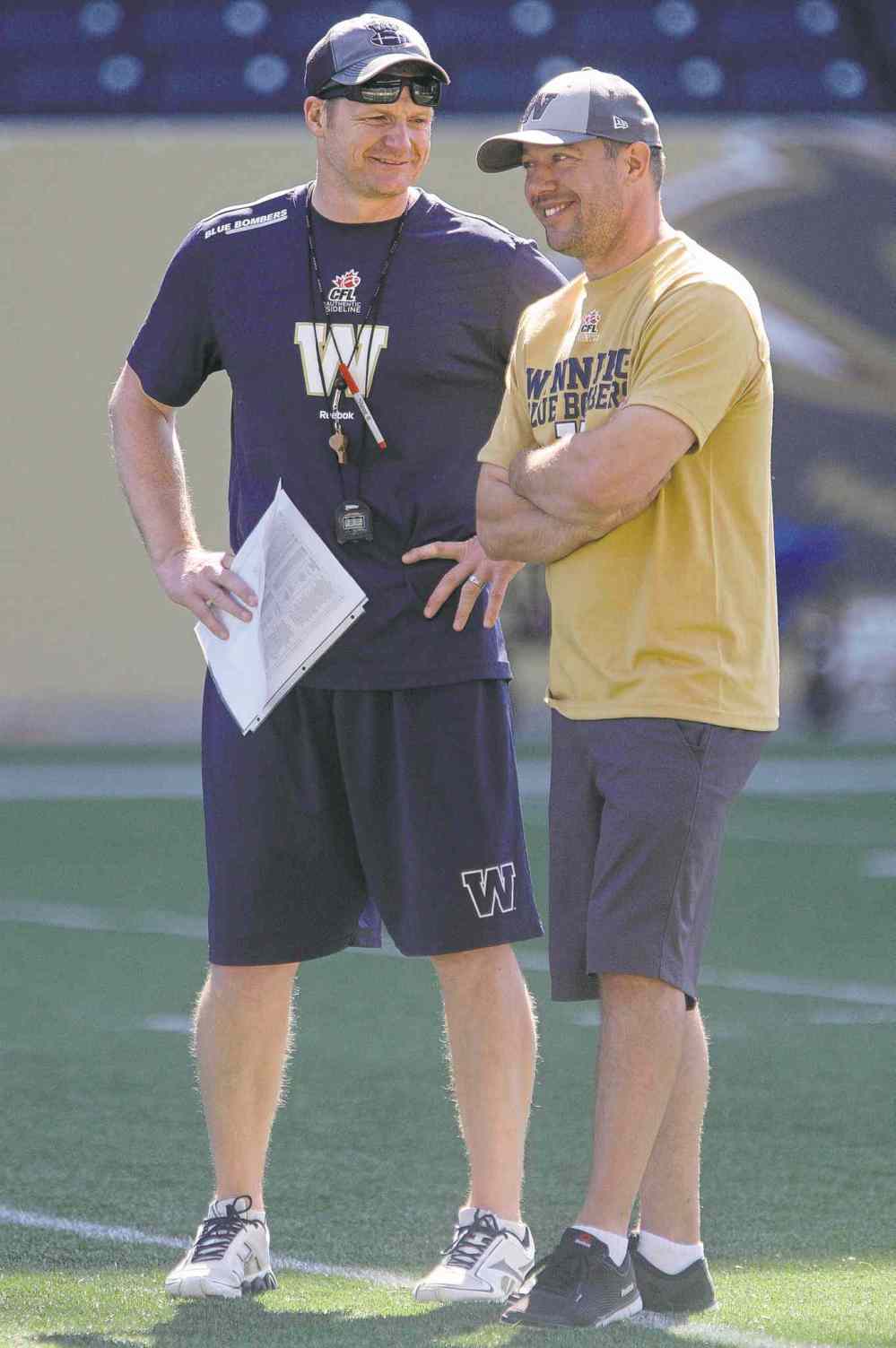 JOE BRYKSA / WINNIPEG FREE PRESS files
Head coach Mike O�Shea (left) and GM Kyle Walters will have their fingerprints all over this season�s edition of the Blue.