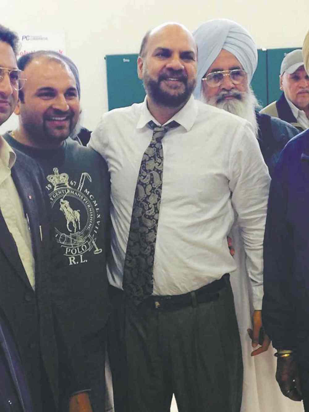 Kaur Sidhu (centre)