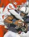 Louis DeLuca / Dallas Morning News / MCT files 
Linebacker Sammy Brown puts the wraps on a quarterback during his college days in Houston.