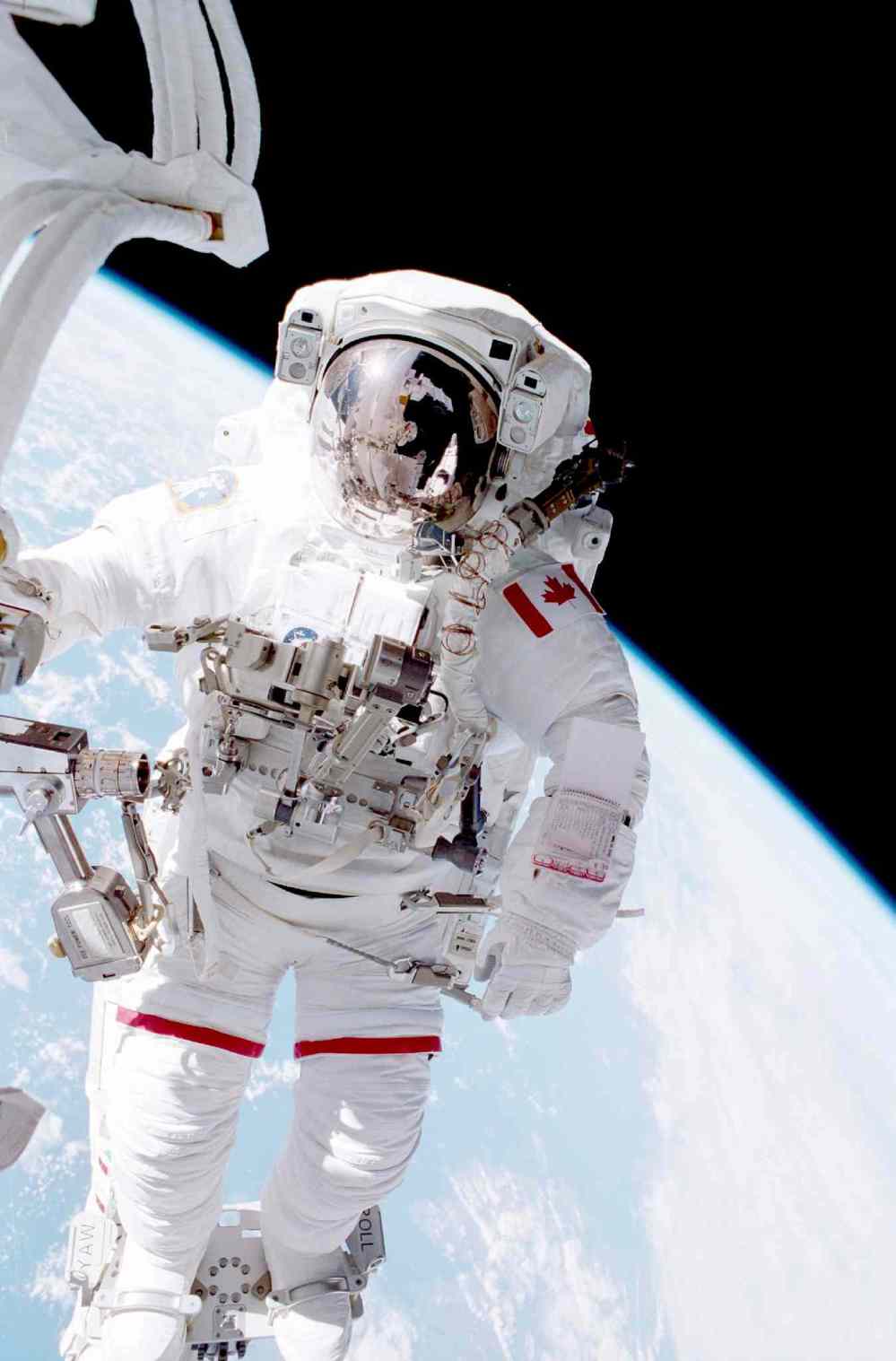 CSA
Astronaut Chris A. Hadfield stands on the portable foot restraint connected to the Endeavour�s Canadarm.