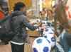A Nigerian player signs autographs for fans Thursday at the airport.