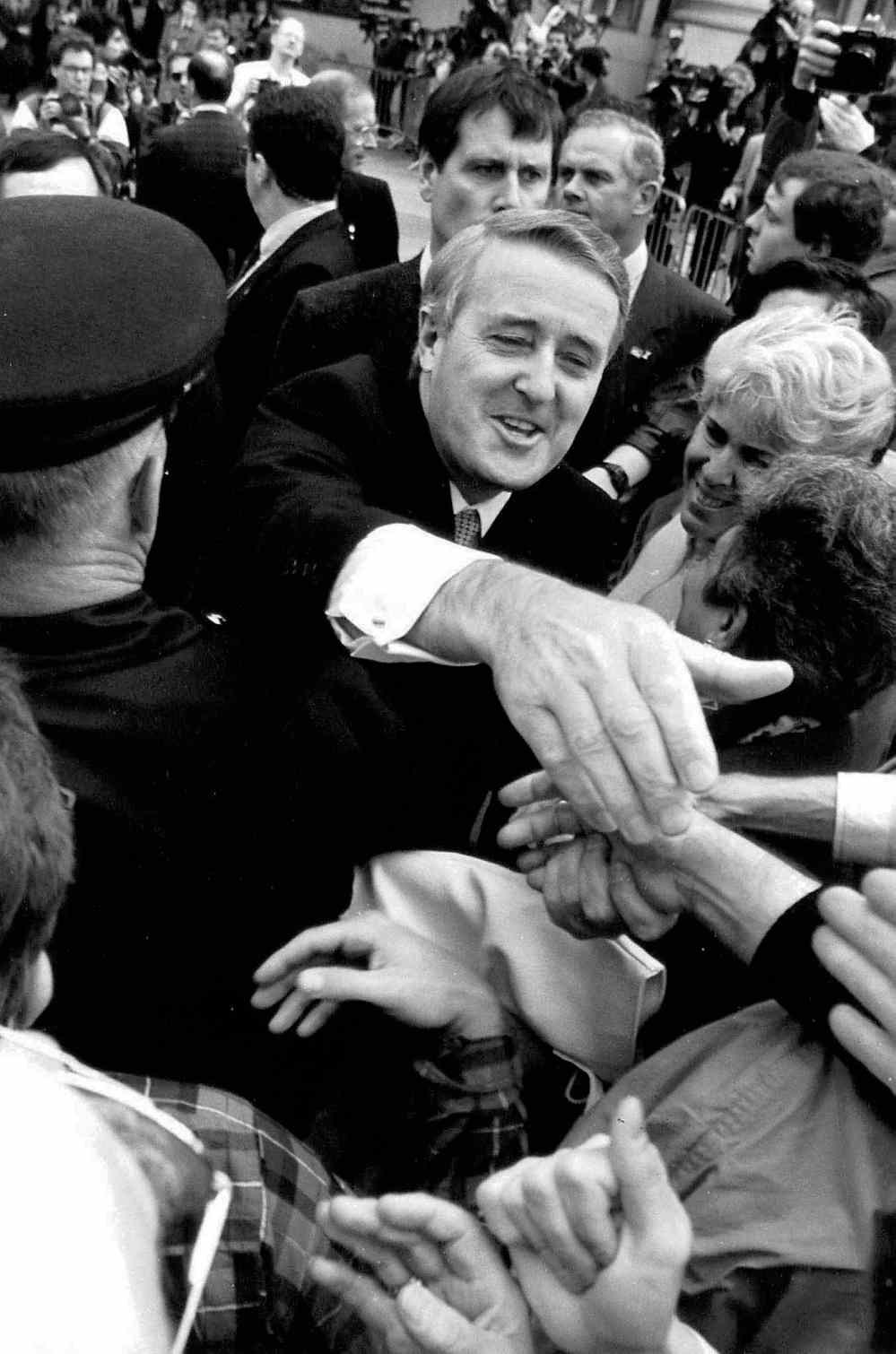 Canadian Press
Fred Chartrand / The Canadian Press FILES
Then-prime minister Brian Mulroney reaches into a crowd gathered outside the site of the Meech Lake accord talks in Ottawa, June 5, 1990.