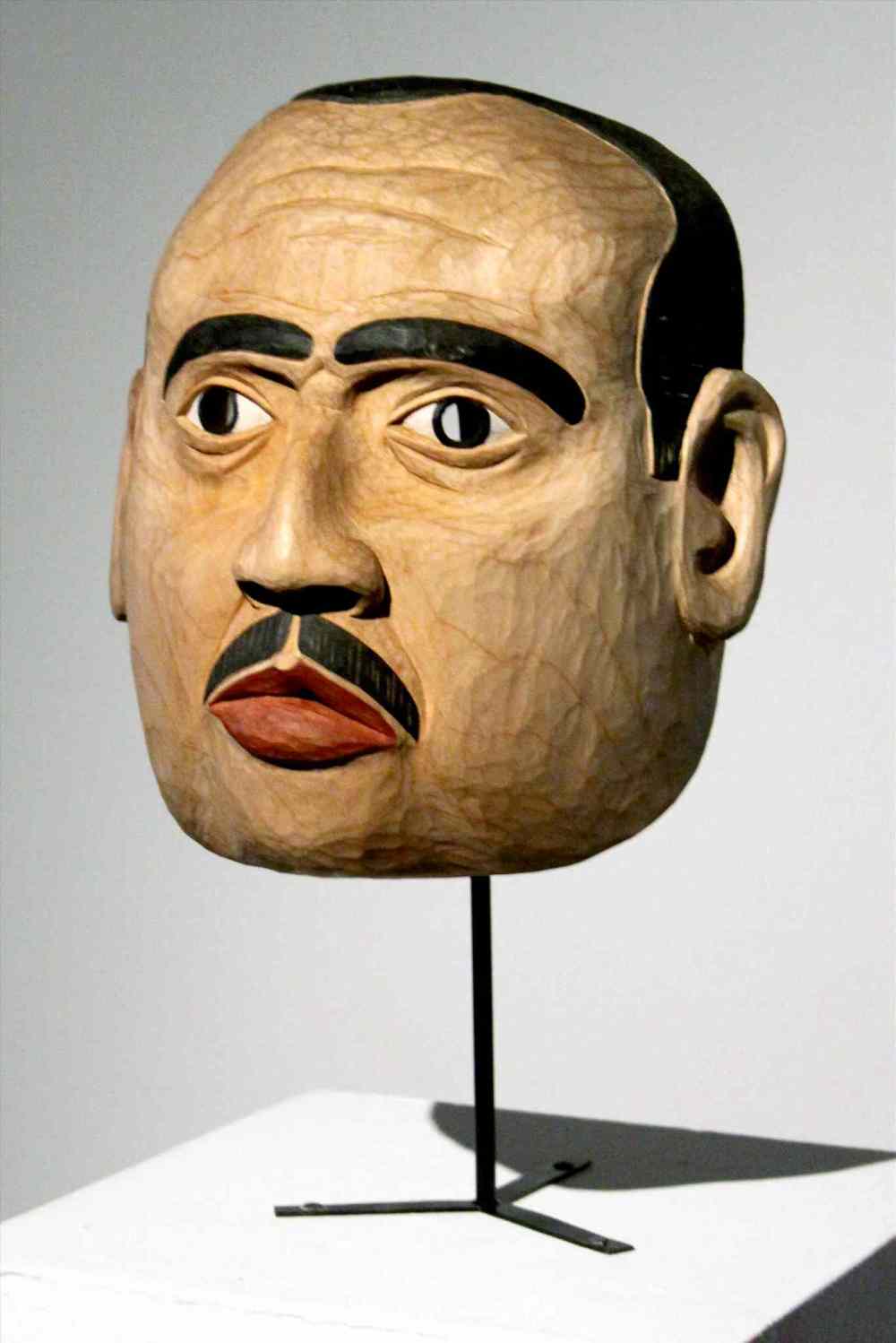 portrait mask of Marlon Brando as The Godfather by the artist’s father, late Tsimshian carver Victor Reece.