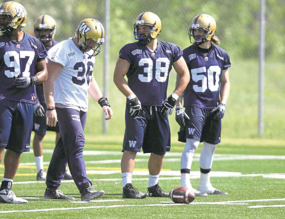 BORIS MINKEVICH / WINNIPEG FREE PRESS
Bombers coach Mike O'Shea wants Ettore Lattanzio (38) to show Friday against Hamilton 'he's that rolling ball of razor blades that everyone says he is.'