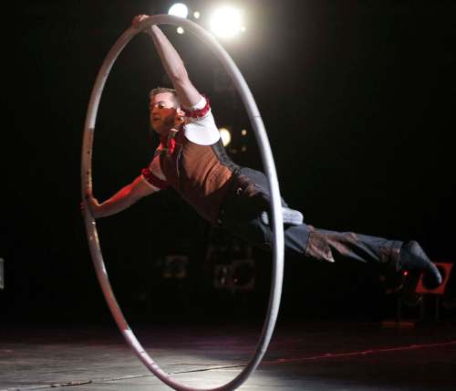 RUTH BONNEVILLE / WINNIPEG FREE PRESS
A performer in the Cirque Mechanics turns his body into a human set of spokes as he spins on a large hoop at WSO Friday night. The show combines combines acrobats, aerialists, trapeze artists, contortionists and an 18-foot, pedal-powered &ldquo;Gantry Crane&rdquo; with music by Tchaikovsky, Strauss, Copland, and Ravel at WSO Friday evening.
Cirque Mechanics was founded in 2004 by German wheel artist Chris Lashua and with its innovative mechanical staging and inspiring storytelling.
May 13, , 2016
