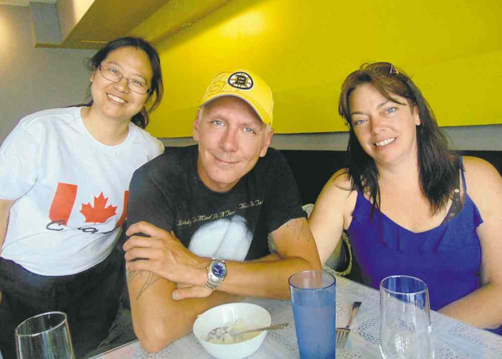 Sunshine�s Ling Wang with Peter Long and Tricia Geller.