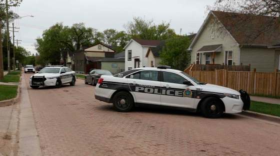 TREVOR HAGAN / WINNIPEG FREE PRESSWinnipeg Police officers at a scene on Magnus Avenue near Aikins Street after an early morning shooting Sunday.
