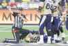 Peter Power / The Canadian Press
Winnipeg Blue Bombers' Drew Willy, centre, grimaces in pain while an official calls for help from the sideline during the second half of CFL football action in Hamilton, Ont., on Sunday, August 9, 2015. The Hamilton Tiger-Cats defeated the Winnipeg Blue Bombers 38-8.