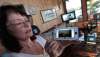 PHIL HOSSACK / WINNIPEG FREE PRESS
Sandy Fisette displays photos taken across Caddy Lake’s Green Bay of the fire that forced their evacuation. Her husband, Grant, is a volunteer firefighter who fought to ensure the safety of the cottages.