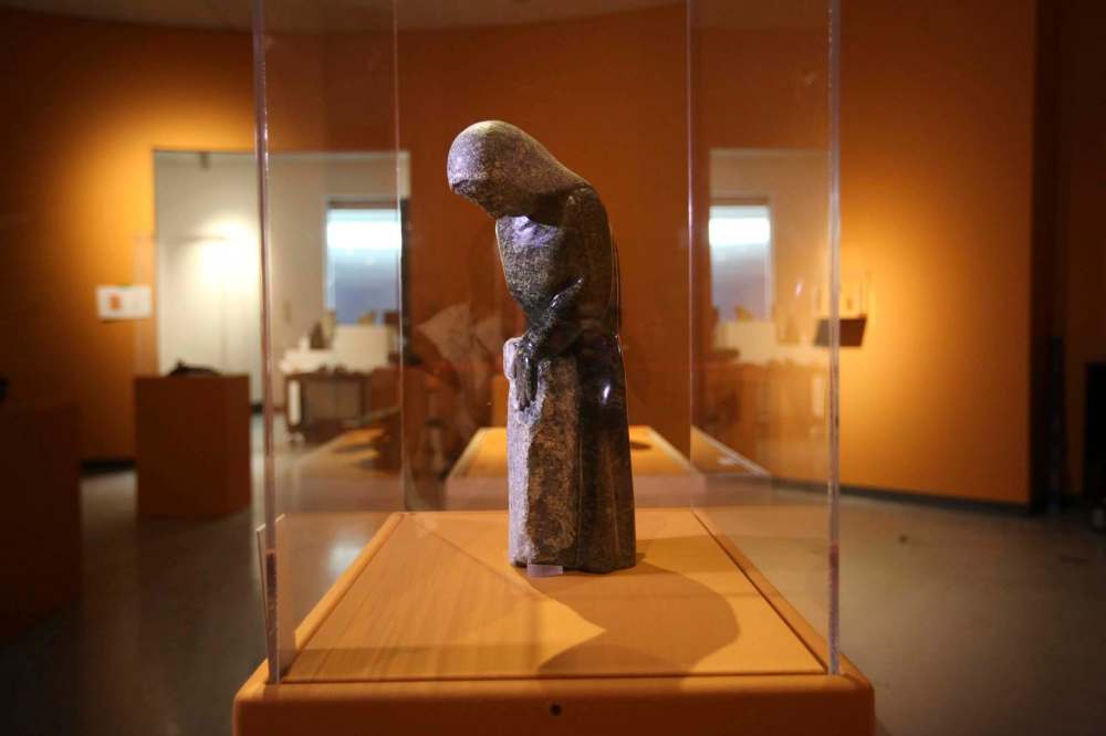RUTH BONNEVILLE / WINNIPEG FREE PRESS
Oviloo Tunnillie, Woman Carving Stone, 2008, serpentinite.