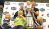 Jeff hamilton / winnipeg free press
Snow Lake kids get a kick out of acquainting themselves with the Grey Cup Tuesday, under the supervision of former Bombers Brett MacNeil (left) and Doug Brown.