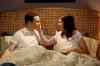 CBS
Amy (Mayim Bialik, right) distracts Sheldon (Jim Parsons) from her disappointing lack of gold bikini.
