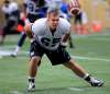 PHIL HOSSACK / WINNIPEG FREE PRESS
Michael Couture keeps tabs on the ball at the Blue Bomber rookie camp this week.