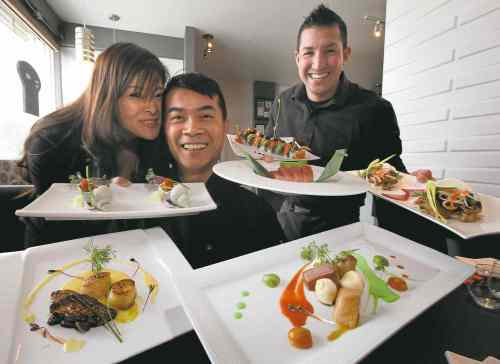 Phil Hossack / Winnipeg Free Press Files
Left to right: Lisa and Chris Taing with Amos Ramon of Fusian Experience.