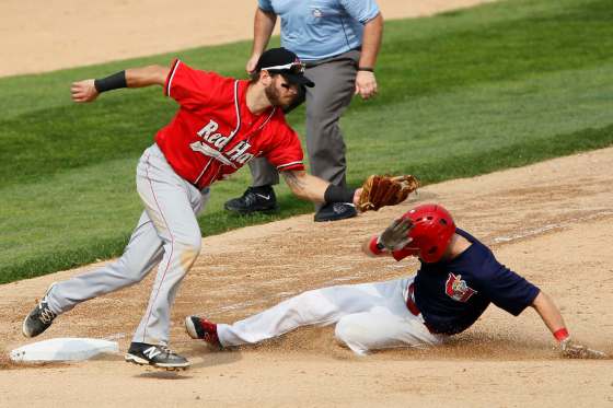 August 30, 2015 - 150830 - Winnipeg Goldeyes' Adam Heisler (8) beats the throw to Fargo-Moorhead RedHawks' Michael Wing (4) for the steal Sunday, August 30, 2015. John Woods / Winnipeg Free Press