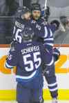 John Woods / WINNIPEG FREE PRESS 
Dustin Byfuglien (right) scored his 15th goal of the season Tuesday night and after the game expressed his love for Winnipeg.