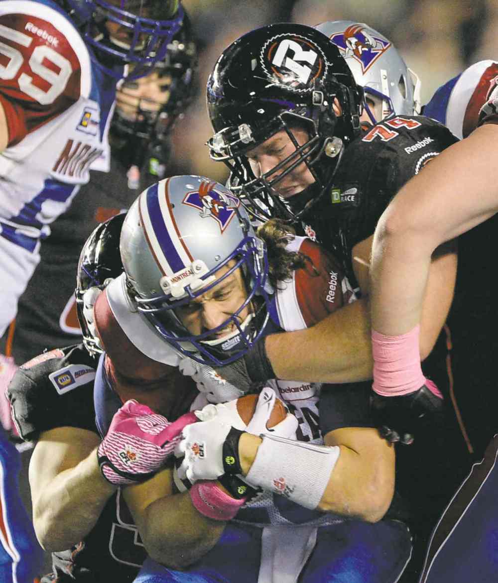 Sean Kkilpatrick / The Canadian Press Files
Keith Shologan, as an Ottawa Redblack, sacks Montreal Alouettes quarterback Jonathan Crompton.