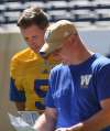 JOE BRYKSA / WINNIPEG FREE PRESS
Blue Bombers offensive co-ordinator Paul LaPolice (right) works with Drew Willy at practice Tuesday