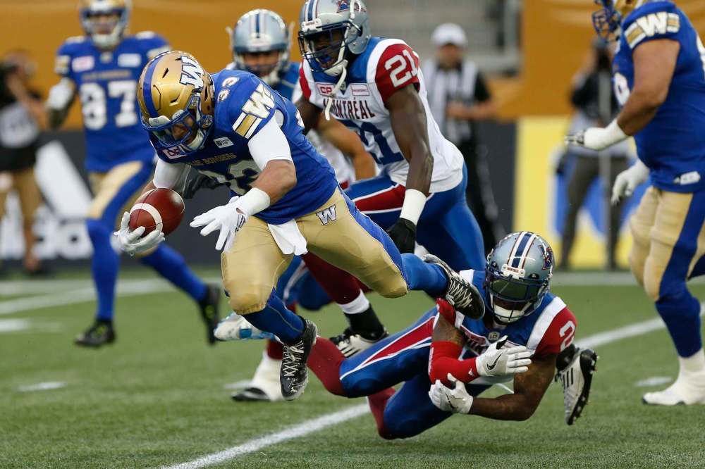 JOHN WOODS / THE CANADIAN PRESS FILES
Winnipeg Blue Bombers running back Andrew Harris put the slip on Jovon Johnson of the Montreal Alouettes Wednesday and will be looking to juke some Ottawa defenders Monday night.