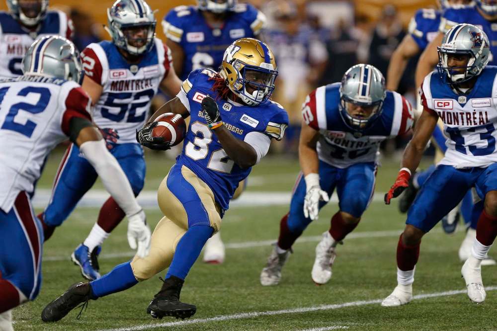 JOHN WOODS / THE CANADIAN PRESS FILES
Winnipeg Blue Bombers' Timothy Flanders (32) runs against the Montreal Alouettes during the second half of Wednesday's pre-season opener.