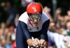 The Olympic Rings are reflected on Britain's gold medalist Bradley Wiggins' helmet as he competes on his way to win the men's individual time trial cycling event at the 2012 Summer Olympics, Wednesday, Aug. 1, 2012, in London. (AP Photo/Lefteris Pitarakis)