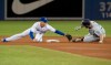 San Diego Padres Eric Hosmer is out at second base trying to stretch a single into a double as Toronto Blue Jays second baseman Cavan Biggio makes the tag in the fourth inning of their interleague MLB baseball game in Toronto, Sunday, May 26, 2019. THE CANADIAN PRESS/Fred Thornhill