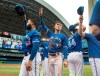 Toronto Blue Jays players including Cavan Biggio (second from left) tip their hats to fans during the middle of third inning of their American League MLB baseball game against the Tampa Bay Rays in Toronto, Sunday, September 29, 2019. THE CANADIAN PRESS/Fred Thornhill