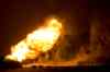 Photo by Jordan McRae
Vehicles are seen near a fire burning following an explosion at a natural gas pipeline near Otterburne, Man.