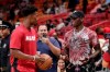 Miami Heat forward Jimmy Butler, left, talks with Manchester United midfielder Paul Pogba, right, before a NBA basketball game between the Miami Heat and New Orleans Pelicans, Saturday, Nov. 16, 2019, in Miami. (AP Photo/Lynne Sladky)