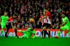 FC Barcelona's Lionel Messi, falls beside Athletic Bilbao's Inigo Martinez, left, during the Spanish La Liga soccer match between Athletic Bilbao and FC Barcelona at San Mames stadium, in Bilbao, northern Spain, Sunday, Feb. 10, 2019.(AP Photo/Alvaro Barrientos)