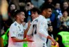 Real Madrid's Casemiro, right, celebrates with teammates Lucas Vazquez, left, and Alvaro Odriozola after scoring his team's first goal during a La Liga soccer match between Real Madrid and Girona at the Bernabeu stadium in Madrid, Spain, Sunday, Feb. 17, 2019. (AP Photo/Andrea Comas)