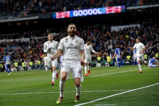Real Madrid's Karim Benzema celebrates his goal during a La Liga soccer match between Real Madrid and Deportivo Alaves at the Bernabeu stadium in Madrid, Spain, Sunday, Feb. 3, 2019. (AP Photo/Andrea Comas)