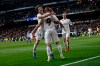 Real Madrid's Karim Benzema, center, celebrates his goal with his teammates Alvaro Odriozola and Gareth Bale, right, during a La Liga soccer match between Real Madrid and Deportivo Alaves at the Bernabeu stadium in Madrid, Spain, Sunday, Feb. 3, 2019. (AP Photo/Andrea Comas)