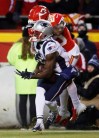 New England Patriots wide receiver Phillip Dorsett (13) makes a touchdown reception against Kansas City Chiefs cornerback Steven Nelson (20) during the first half of the AFC Championship NFL football game, Sunday, Jan. 20, 2019, in Kansas City, Mo. (AP Photo/Charlie Riedel)