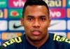 FILE -- In this Nov. 19, 2018 file photo Brazil's Alex Sandro speaks during a press conference ahead of the International friendly soccer match between Brazil and Cameroon, at MK Stadium in Milton Keynes, England. Alex Sandro has renewed his contract with Juventus until 2023, Juventus announced with a statement on its website Thursday, Dec. 20, 2018. (AP Photo/Frank Augstein)