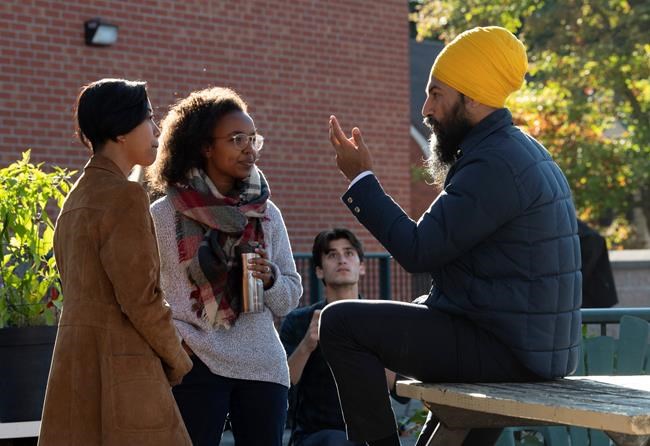 NDP leader Jagmeet Singh speaks with two women following a campaign announcement in Ottawa, Tuesday September 17, 2019. Singh continued his push to win progressive votes on Tuesday by promising an NDP government would invest billions of dollars in affordable housing to help Canadians struggling to make ends meet. THE CANADIAN PRESS/Adrian Wyld