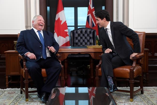 Prime Minister Justin Trudeau and the Premier of Ontario Doug Ford share a laugh after Ford spoke in French during a meeting in Ottawa on Friday, Nov. 22, 2019. THE CANADIAN PRESS/Adrian Wyld