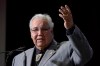Commission chairman Justice Murray Sinclair raises his arm asking residebtial school survivors to stand at the Truth and Reconciliation Commission in Ottawa on Tuesday, June 2, 2015. THE CANADIAN PRESS/Adrian Wyld
