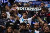 Coruna's fan displays a scarf reading 
