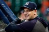 New York Yankees manager Aaron Boone smiles during batting practice before Game 1 of baseball's American League Championship Series against the Houston Astros Saturday, Oct. 12, 2019, in Houston. (AP Photo/Eric Gay)