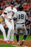 Houston Astros relief pitcher Ryan Pressly, left, tags out New York Yankees' Didi Gregorius during the third inning in Game 6 of baseball's American League Championship Series Saturday, Oct. 19, 2019, in Houston. (AP Photo/Eric Gay)