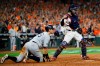Houston Astros catcher Robinson Chirinos, right, celebrates after tagging out New York Yankees' DJ LeMahieu who tried to score on a single by Brett Gardner during the sixth inning in Game 2 of baseball's American League Championship Series Sunday, Oct. 13, 2019, in Houston. (AP Photo/Matt Slocum)