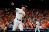 Houston Astros' Carlos Correa celebrates with teammates after his walk-off home run against the New York Yankees during the 11th inning in Game 2 of baseball's American League Championship Series Sunday, Oct. 13, 2019, in Houston. (AP Photo/Matt Slocum)